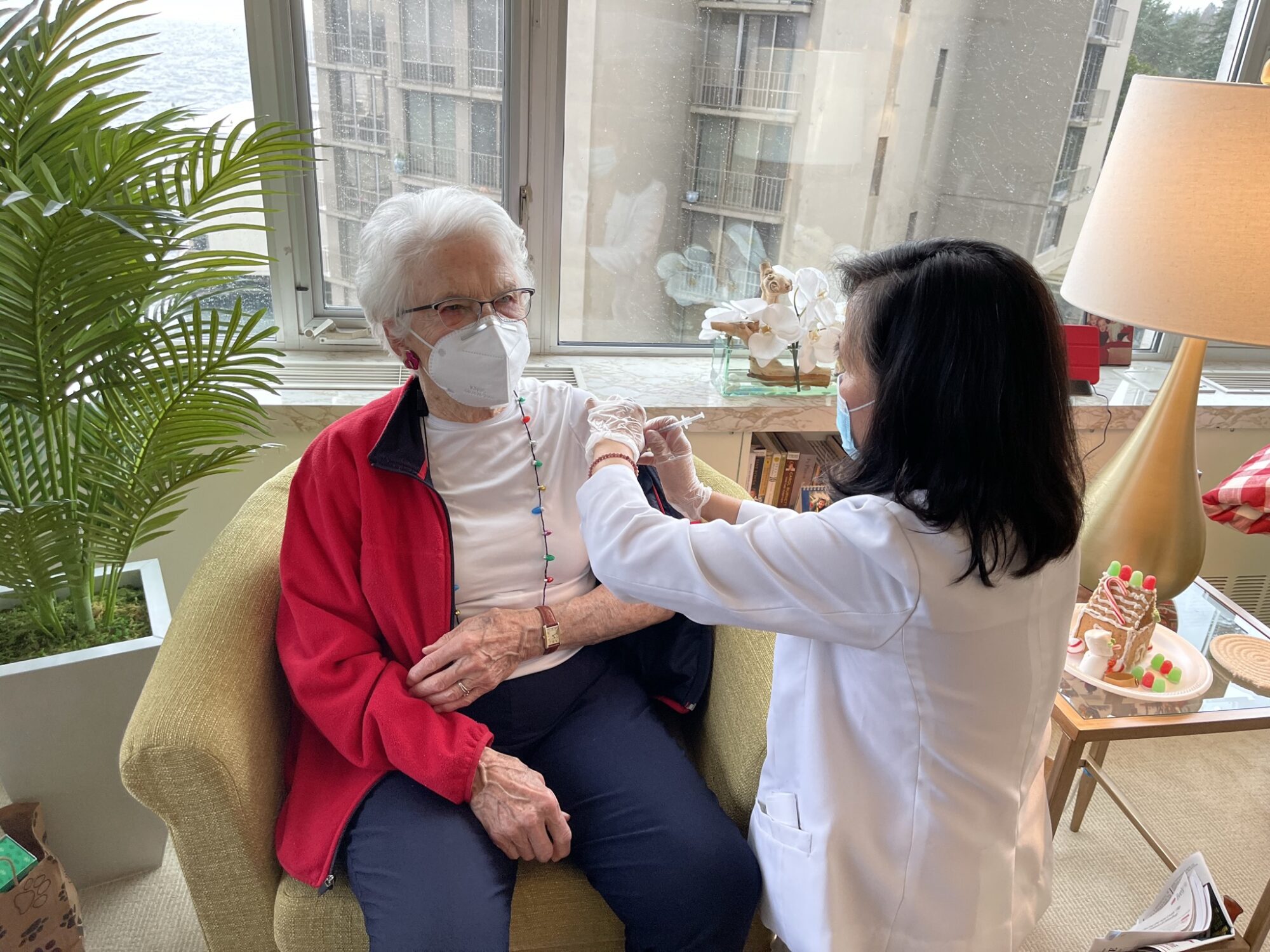 elderly woman receives vaccine