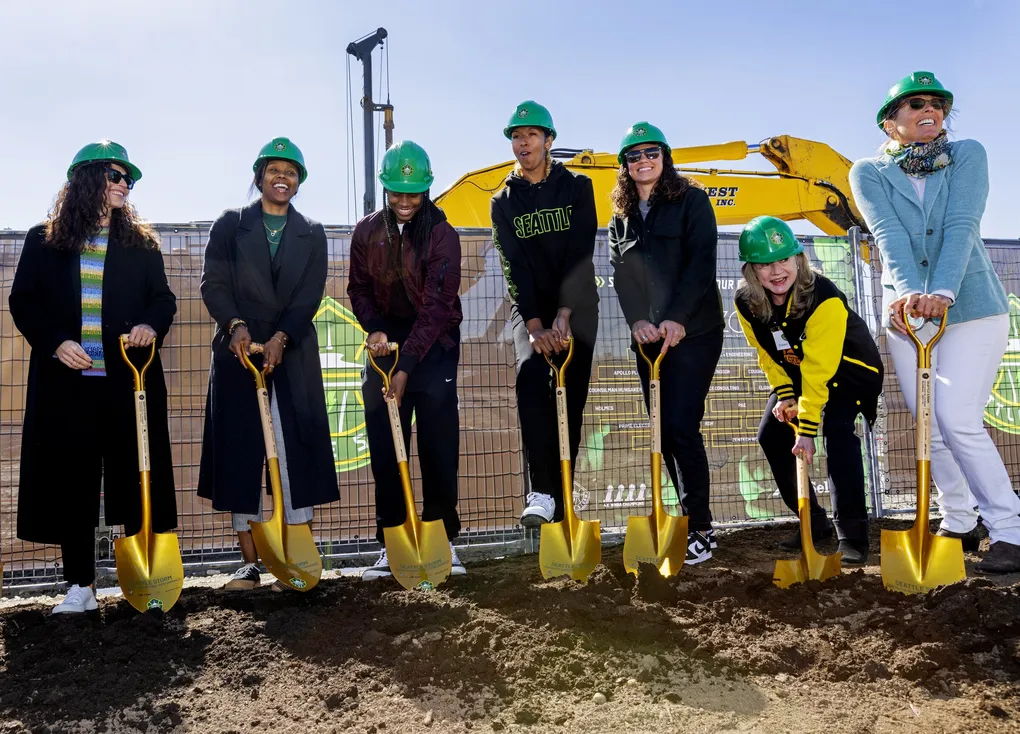 Storm players with golden shovels at a ceremonial groundbreaking